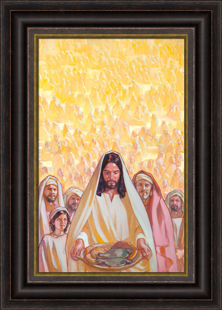 Jesus holding a basket of bread and fish with masses of people behind him.