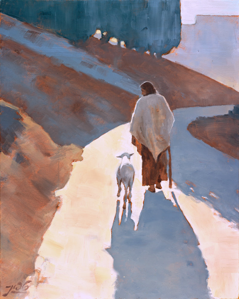 Jesus Christ walking down a path with a sheep.
