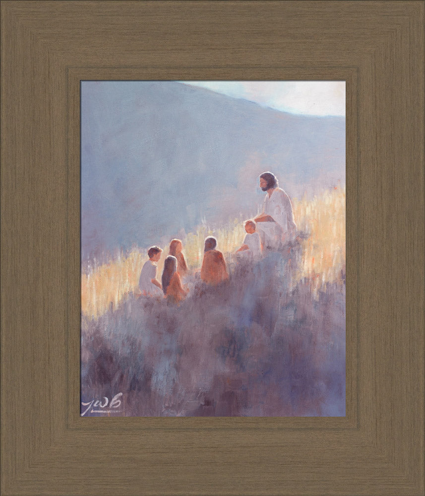 Jesus Christ sitting with children on a hill.