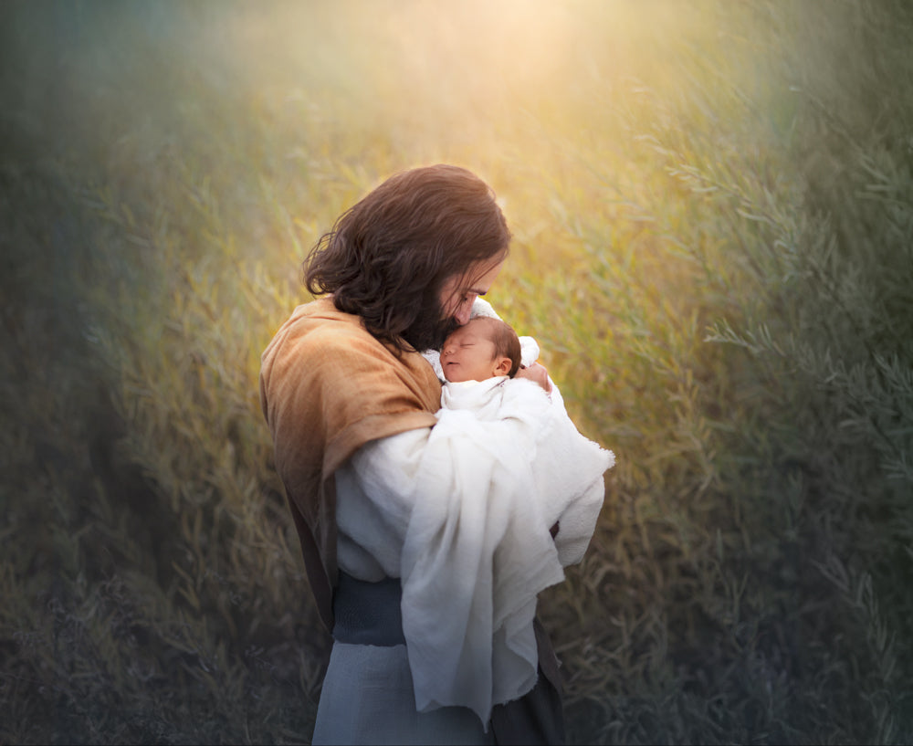 Jesus Christ holding a baby.