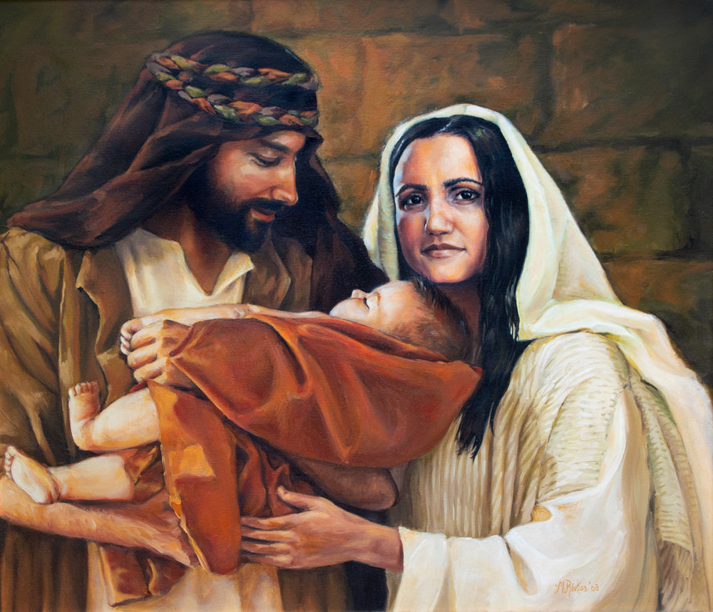 Mary and Joseph holding baby Jesus.