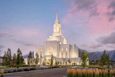 The Orem Utah Temple with a blue sky and pink clouds.