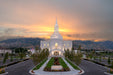 The Orem Utah Temple with the sunset over the mountains.