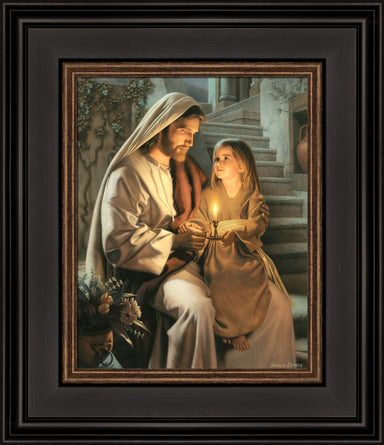 Jesus holding a girl and sharing a candle that is lighting their faces.