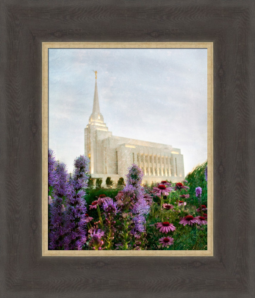 Rexburg Idaho Temple with purple flowers and blue sky.