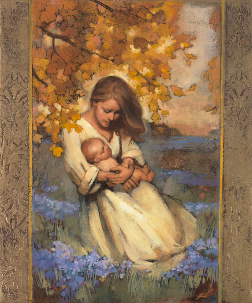 A mother holding and praying for her child surrounded by autumn leaves.