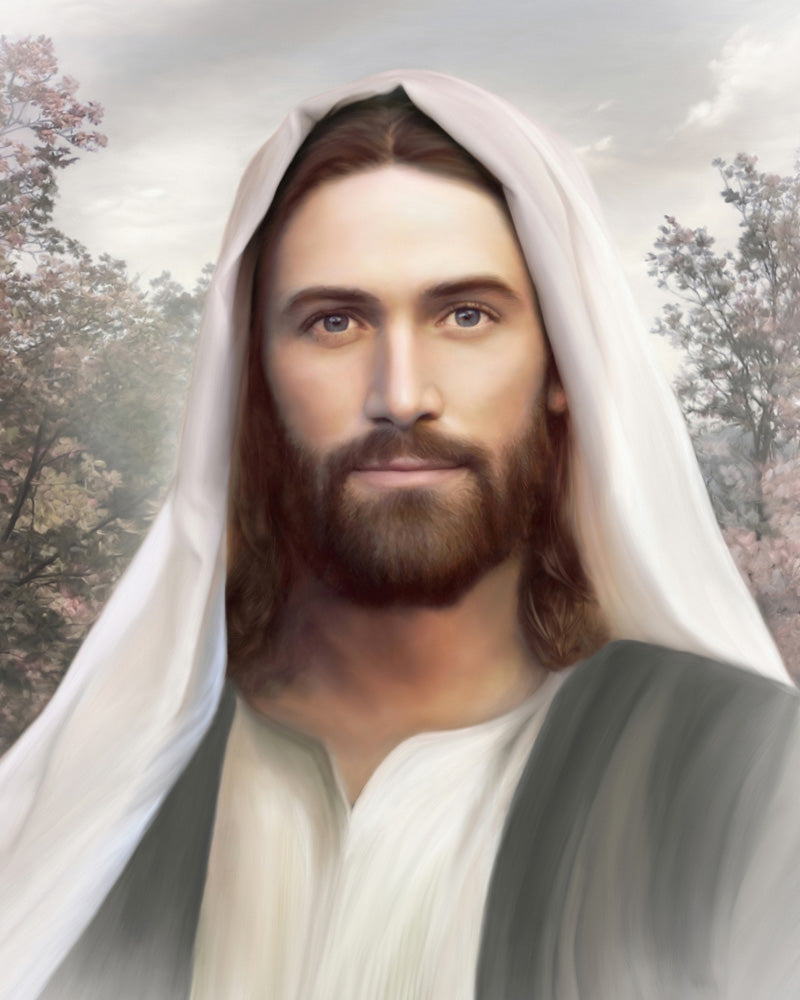 Portrait of Jesus Christ wearing a white shawl on head with trees in the background.