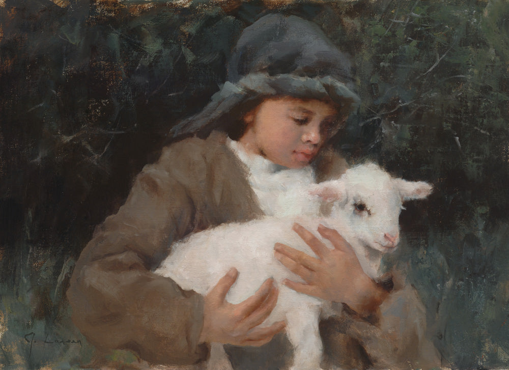 Young shepherd holding a white lamb.