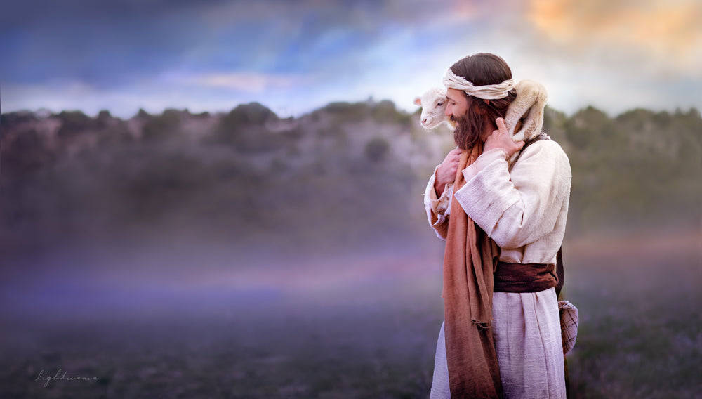 Jesus Christ smiling with a lamb on his shoulders.