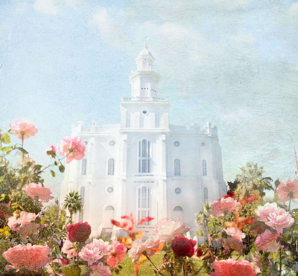 St. George Temple with pick flowers and a blue sky.