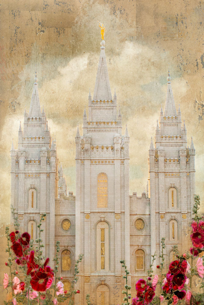 Salt Lake Utah Temple with red and pink flowers.