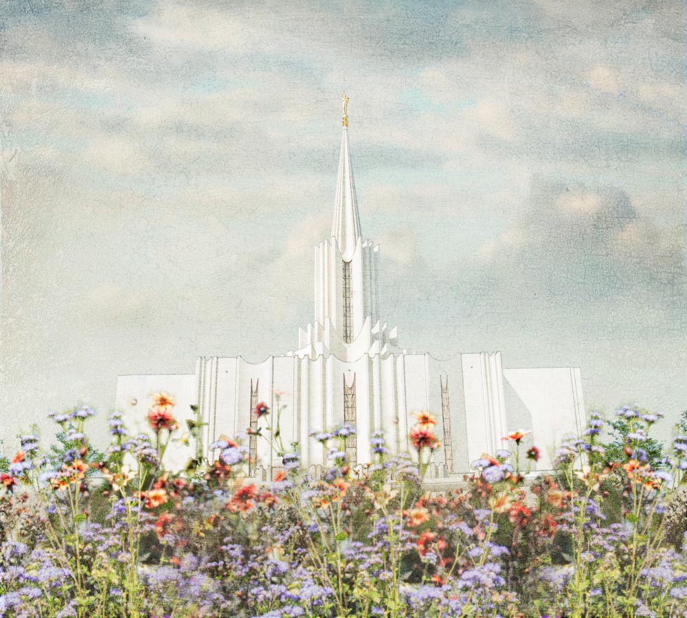 Jordan River Utah Temple with purple and orange flowers.
