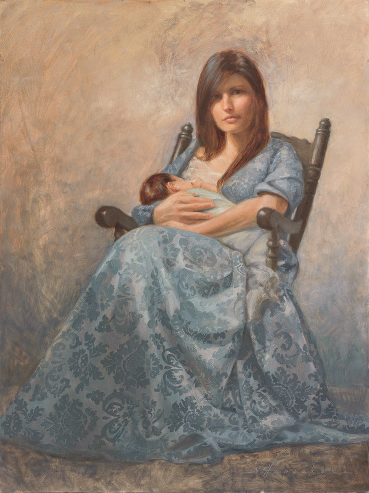 A mother in a blue dress sitting in a rocking chair holding an infant.