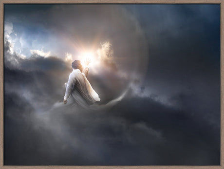 A framed art print depicting a spiritual scene of Jesus Christ in a white robe floating among dark, dramatic clouds with a bright sunburst behind him.