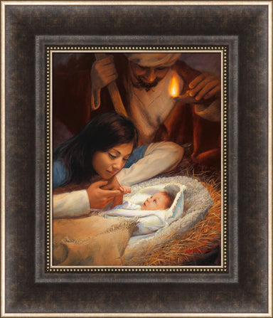 Mary holding baby Jesus' hand with Joseph watching over the manger scene