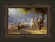 Joseph leading pregnant Mary on a donkey passing a heard of sheep. 