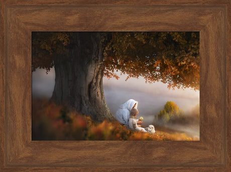 Jesus sitting beneath an autumn tree next to a small child. He is showing the child a white flower.