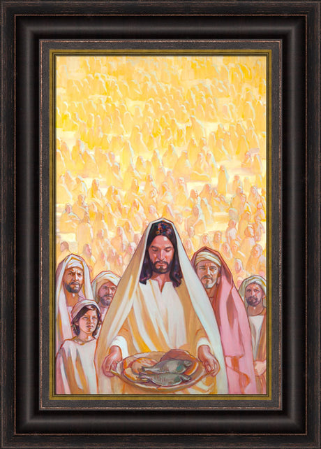Jesus holding a basket of bread and fish with masses of people behind him.