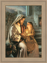 Jesus holding a girl and sharing a candle that is lighting their faces.