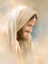 A close portrait of a laughing Christ his face turned to the side with a broad warm smile.