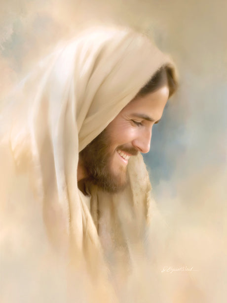 A close portrait of a laughing Christ his face turned to the side with a broad warm smile.