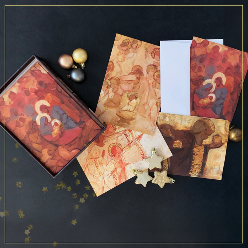 Christian card pack with religious art designs, perfect for thoughtful greetings, displayed with decorative stars on a dark surface.