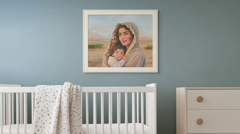 Altus Fine Arts Framed artwork of a woman holding a child above a crib in a nursery.
