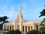 The Fort Lauderdale Florida Temple with palm trees and a blue sky.