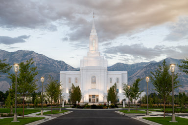 The Orem Utah Temple with the mountains in the background.