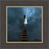 Framed artwork of a woman on a staircase reaching for stars against a dark blue sky.