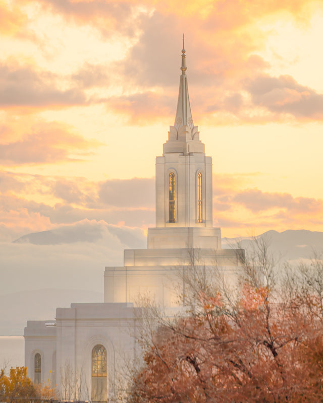 The Orem Utah Temple with a bright yellow sky.