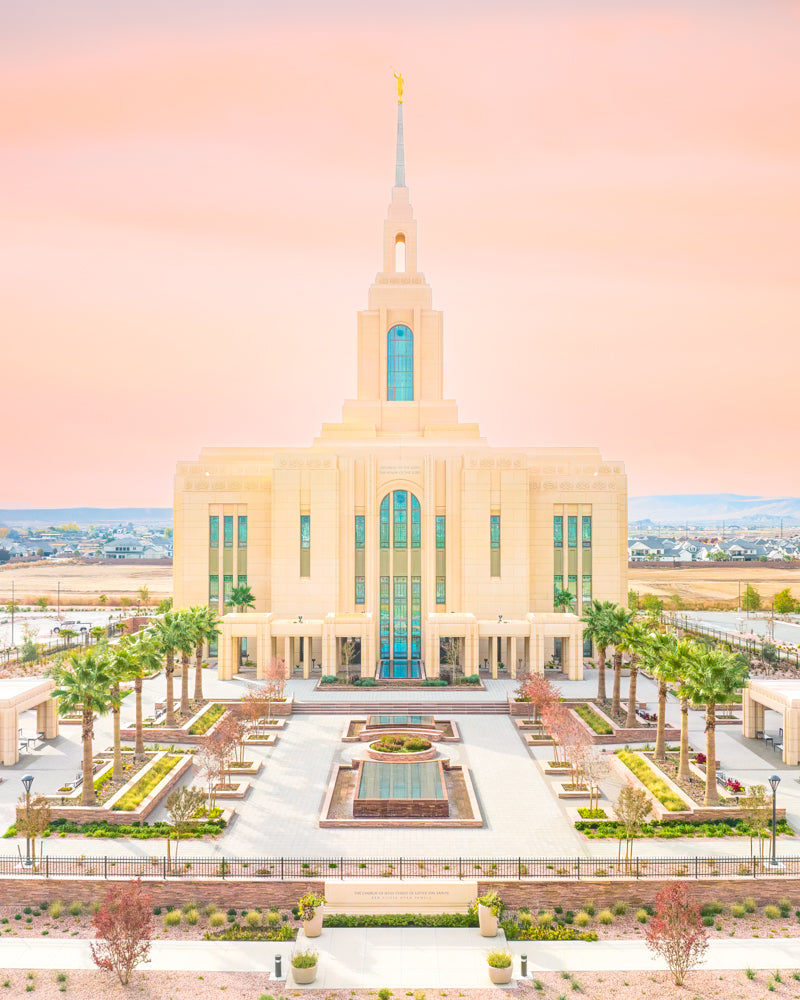 The Red Cliffs Utah Temple with a pink sky.
