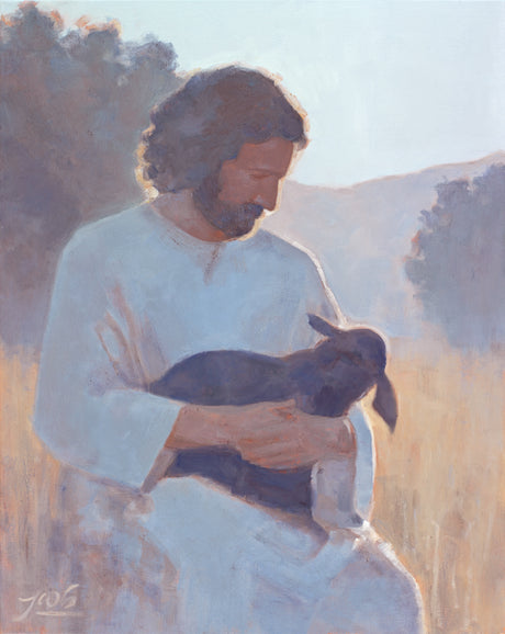 Jesus Christ holding a sheep.