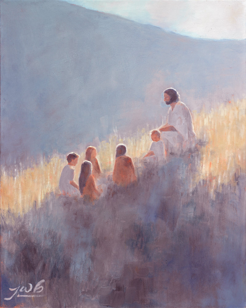 Jesus Christ sitting with children on a hill.