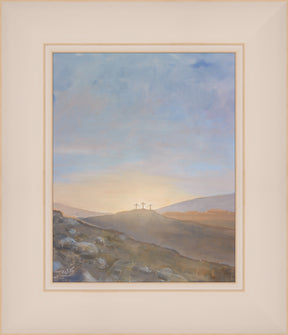 An arch shaped painting of three wooden crosses standing atop a rocky hill, backlit by a rising sun that spreads warm gold and pink light across the sky. In the foreground, scattered stones and dry grass lead the eye toward the hill, with distant mountains fading into soft haze.
