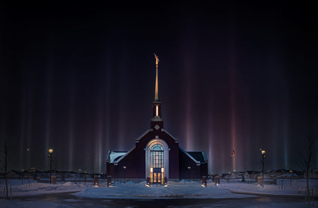 Winnipeg Temple glowing on a dark night.