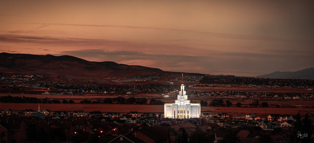 The Saratoga Springs Utah Temple on a red landscape.