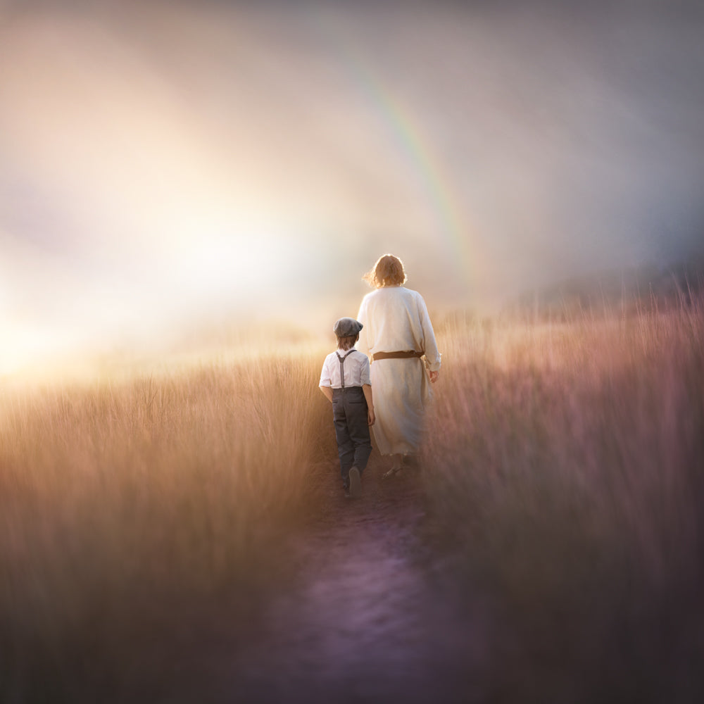 A young boy following Jesus in a field.