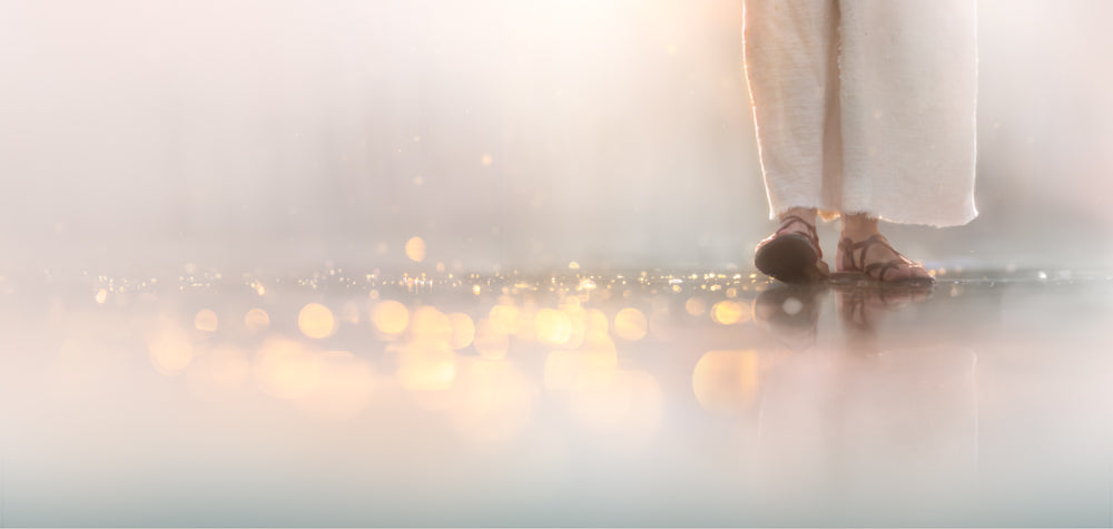 A close-up photo painting of Christ's sandaled feet walking on water, surrounded by soft golden light reflections against a luminous white background.