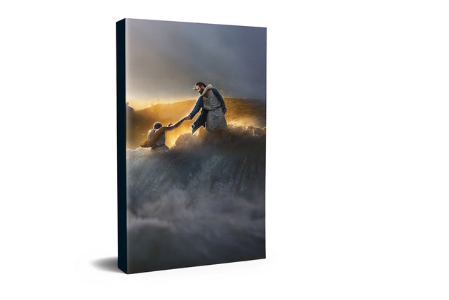 A man and woman navigating a wave in the ocean, embodying resilience and partnership in The Finisher of Faith Christian Journal.