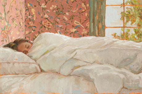 A woman sleeping in her cozy bed.