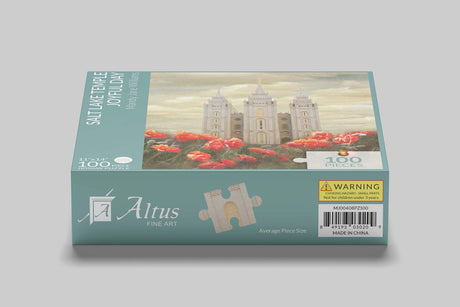 Ornate puzzle box displayed with iconic Mormon temple in the distance, Altus Fine Arts branding.