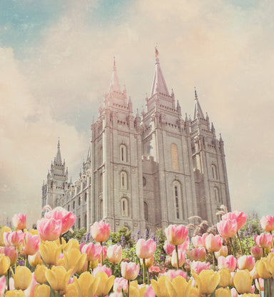 The Salt Lake City Utah Temple with pink and yellow tulips.