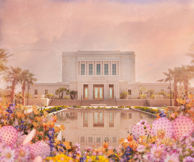 The Mesa Arizona Temple in pink with cacti and desert wildflowers.