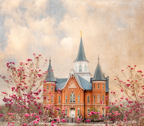 The Provo City Center Utah Temple with pink flowers.