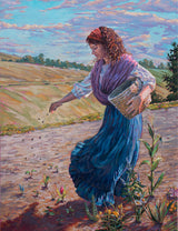 A woman planting seeds in a garden.