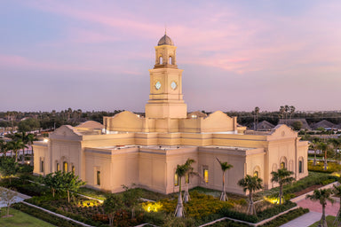 The McAllen Texas Temple with pink clouds.