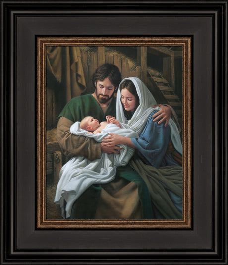 Mary and Joseph hold baby Jesus in the stable.