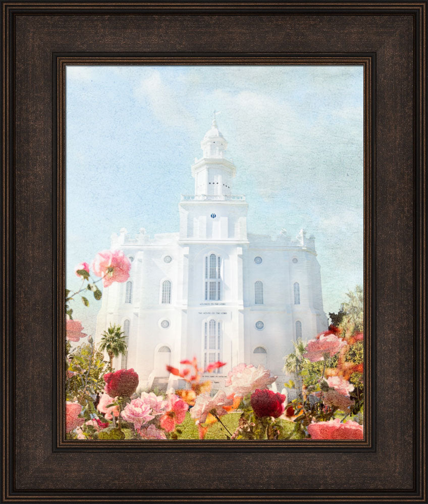 St. George Temple with pick flowers and a blue sky.