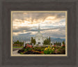 The Orem Utah Temple with light shining through the clouds.